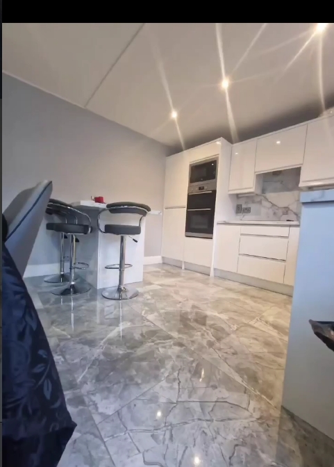 White marble kitchen island, alternate angle
