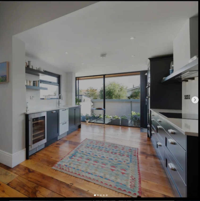 Navy shaker kitchen with reclaimed wood floor, Dublin